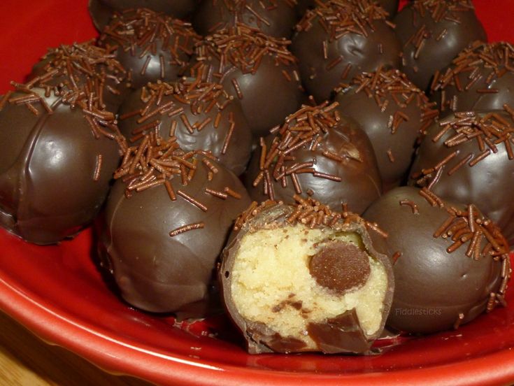 a plate full of chocolate covered desserts on a table