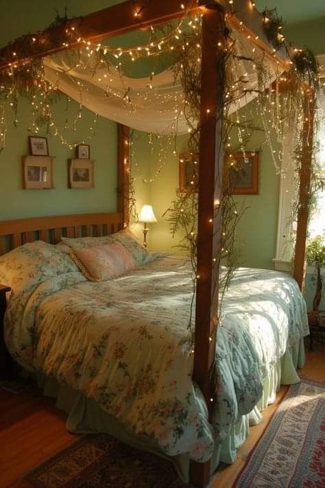 a canopy bed with lights on it in a bedroom