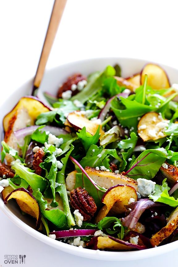 a white bowl filled with salad and vegetables