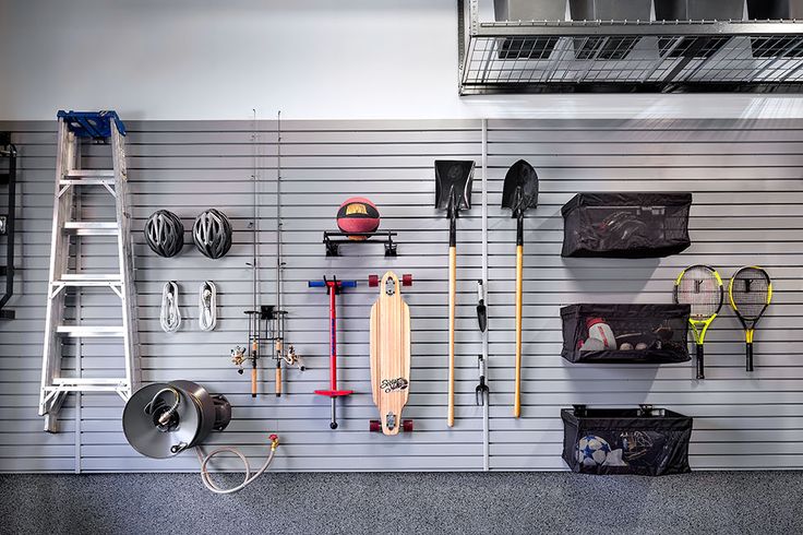 a garage with various tools hanging on the wall