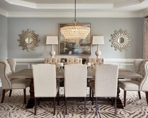 a dinning room table with chairs and a chandelier