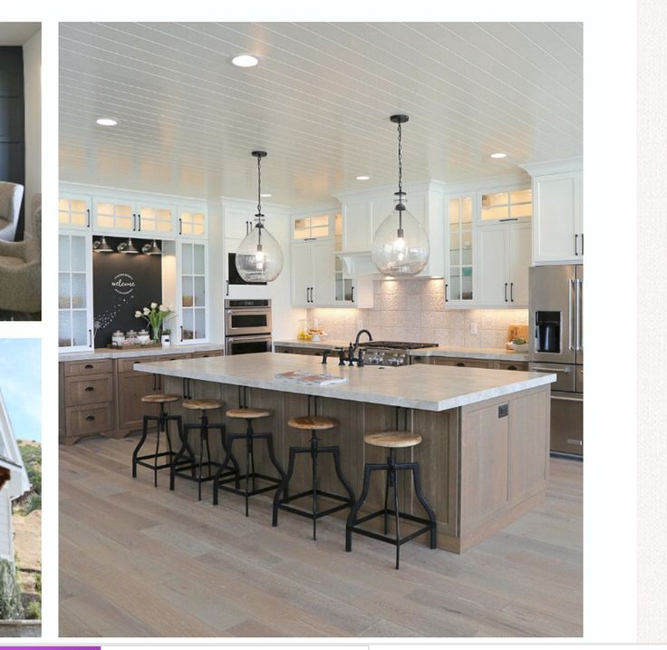 a large kitchen with an island and bar stools