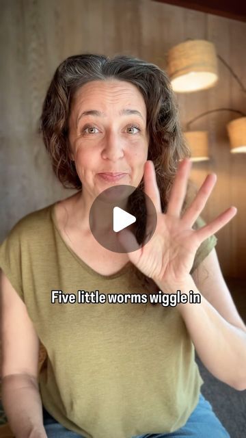 a woman sitting down with her hands in front of her face and the words five little worms