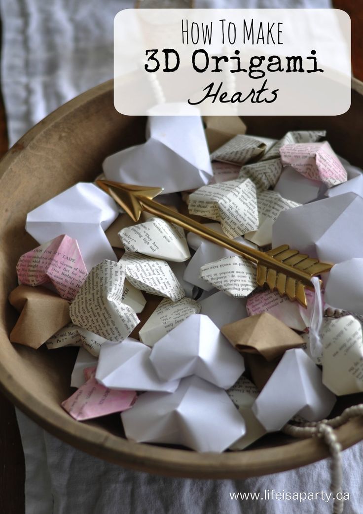 origami hearts in a bowl with the title how to make 3d origami hearts