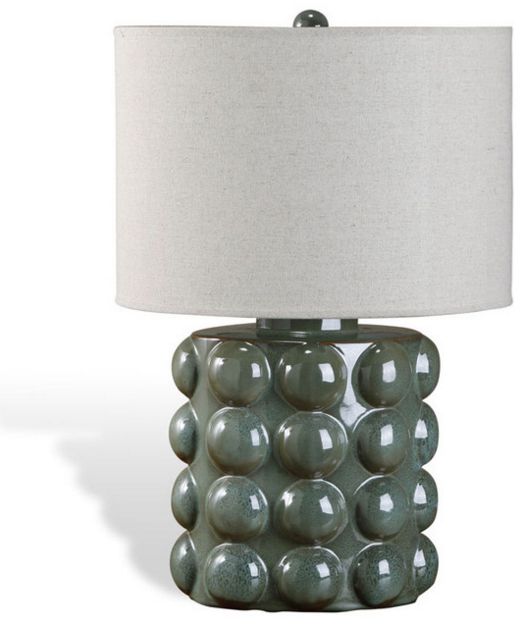 a lamp that has balls on it and a white lampshade with a gray shade