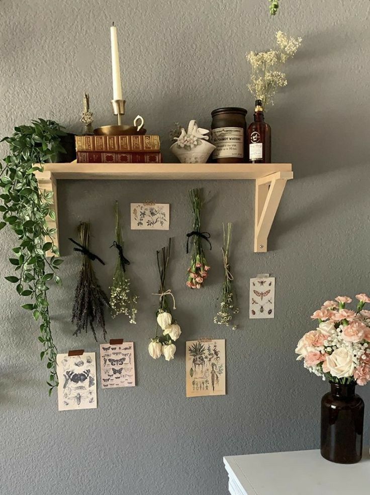 a shelf with flowers and cards hanging on it