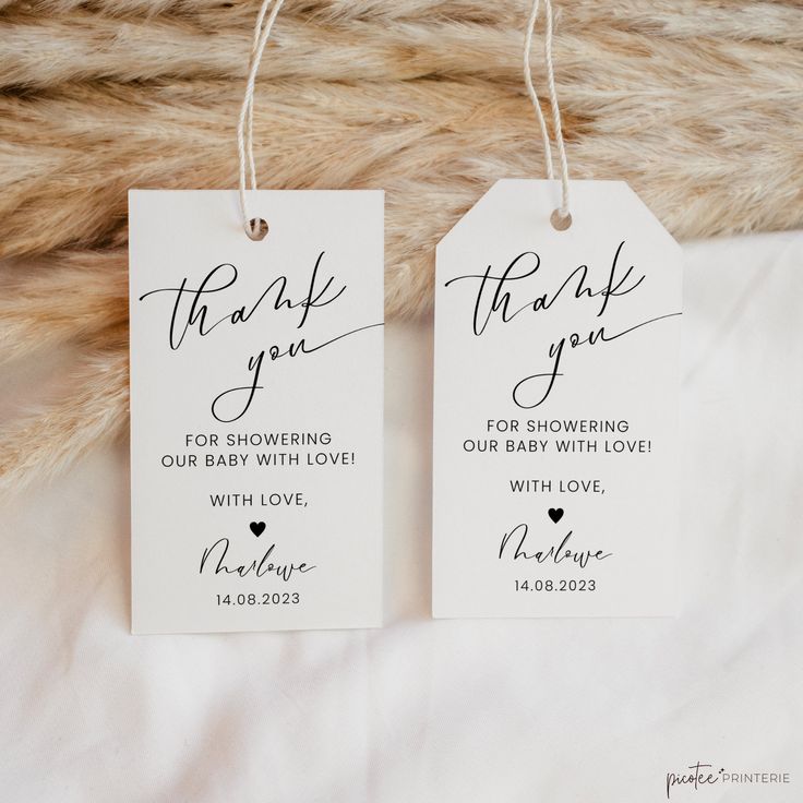 two tags that say thank you for showering our baby love with love