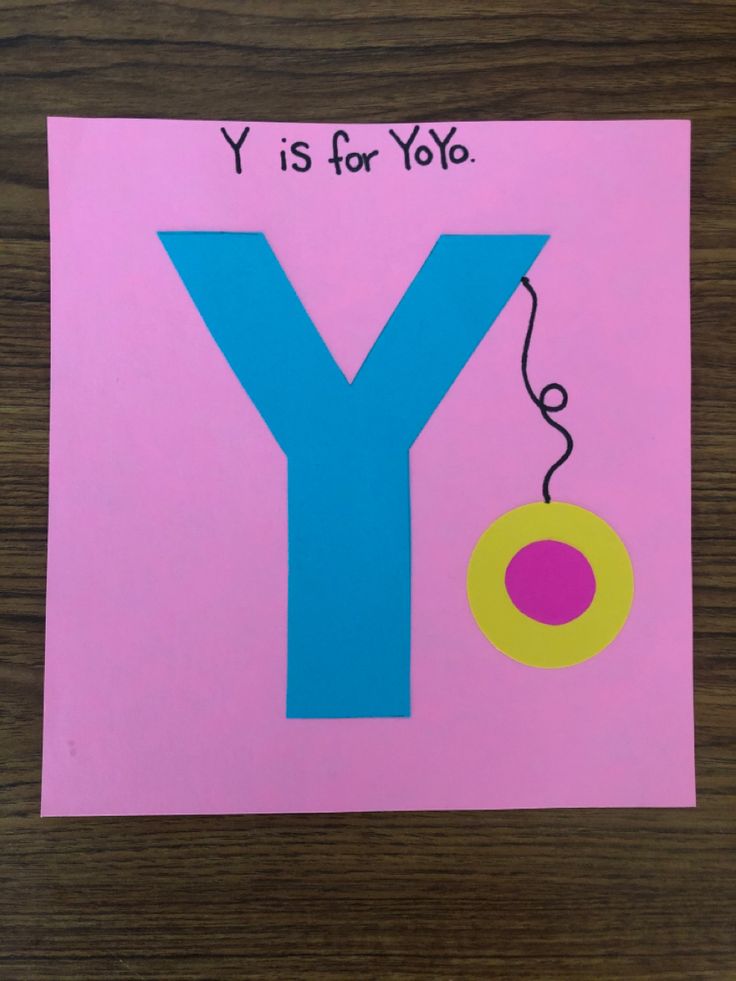 the letter y is for yoyo on a pink paper with blue and yellow circles