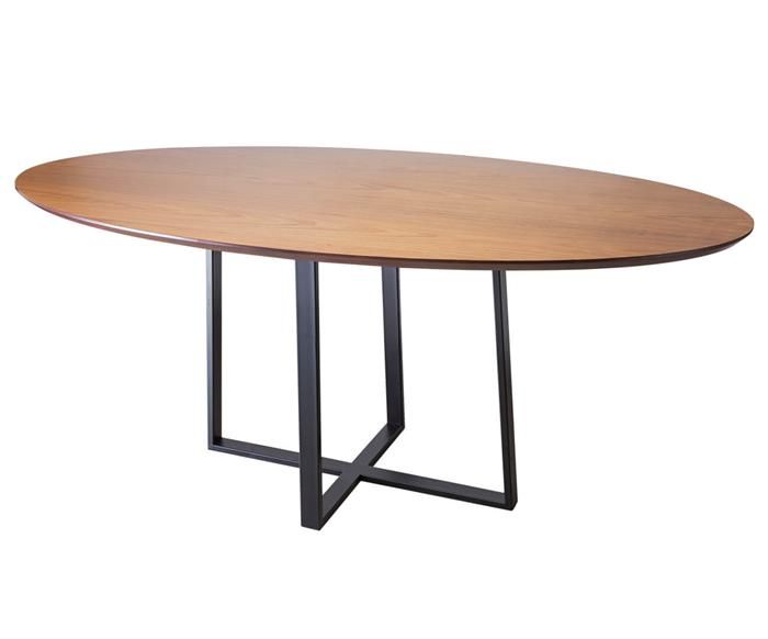 an oval wooden table with metal legs on a white background, viewed from the front