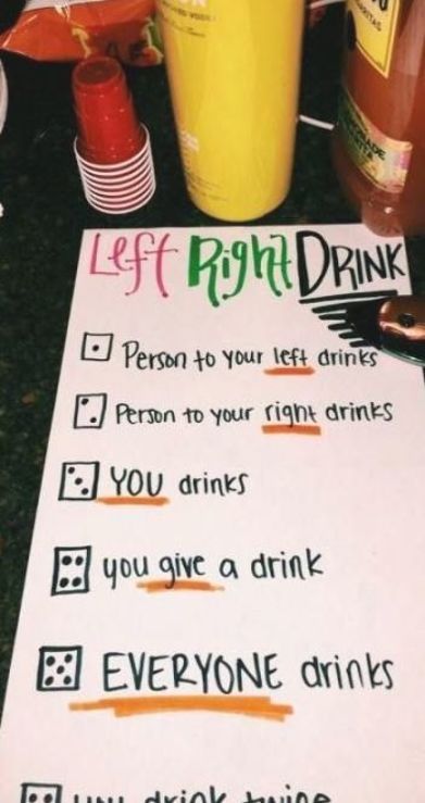 a paper sign that has been placed on top of a table with cups and drinks