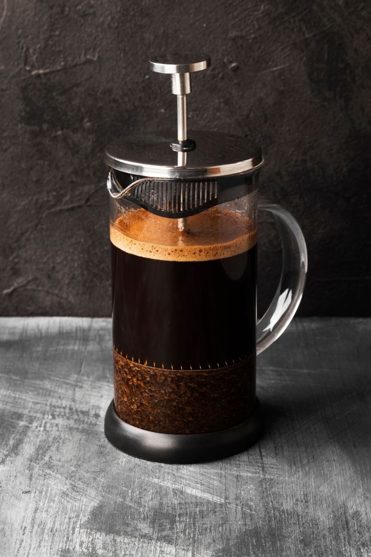 a french press coffee maker on a table