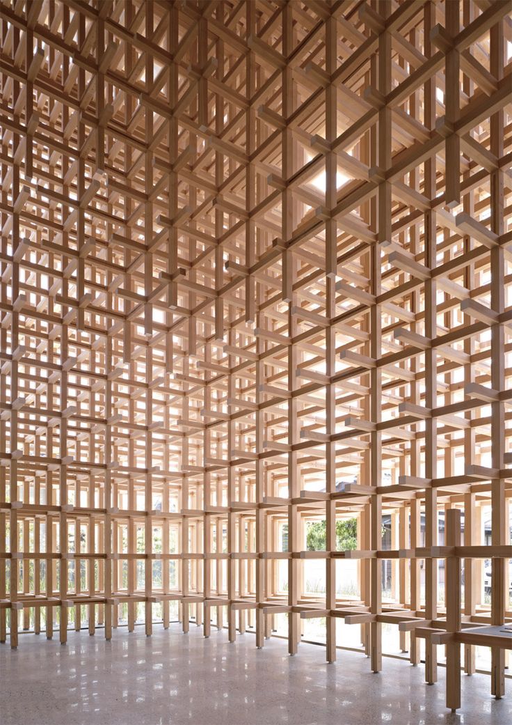 the interior of a building made out of wooden slats