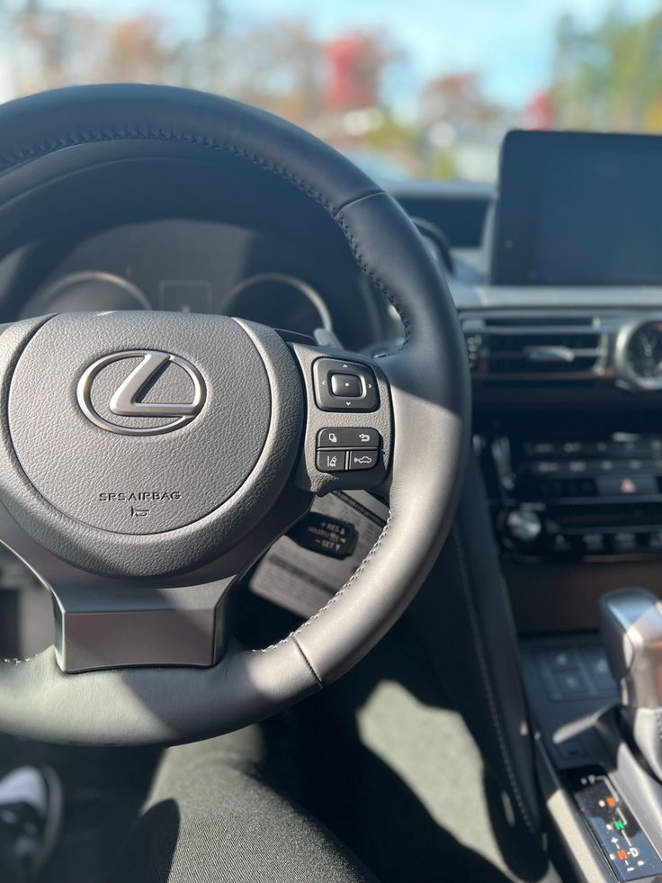 the steering wheel and dashboard of a car with an electronic display on the dash board