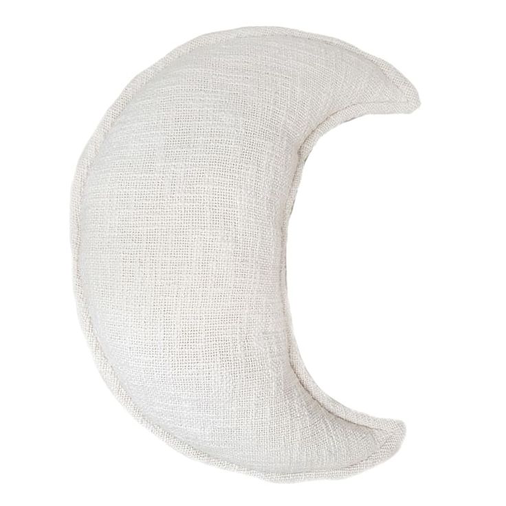 a white pillow that is shaped like the moon