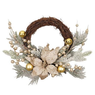 a wreath with gold ornaments and greenery on it's sides is displayed against a white background