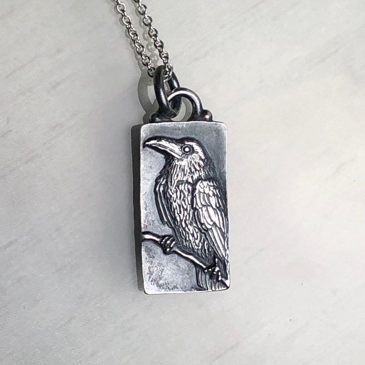 "This wonderful perched Raven was hand carved in wax by Carrie with the aid of a microscope. It was then cast in Sterling Silver and given a dark patina to help show off every feather. The pendant measures 1 1/4\" x 1/2\" and hangs on an 18\" sterling silver chain. Enjoy!" Raven Jewelry, Raven Pendant, Raven Necklace, Piercing Inspo, Precious Metal Clay, Owl Pendant, Scottsdale Az, Metal Clay, Lovely Jewellery