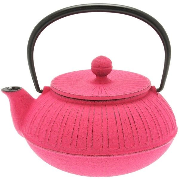 a pink tea pot with a black handle