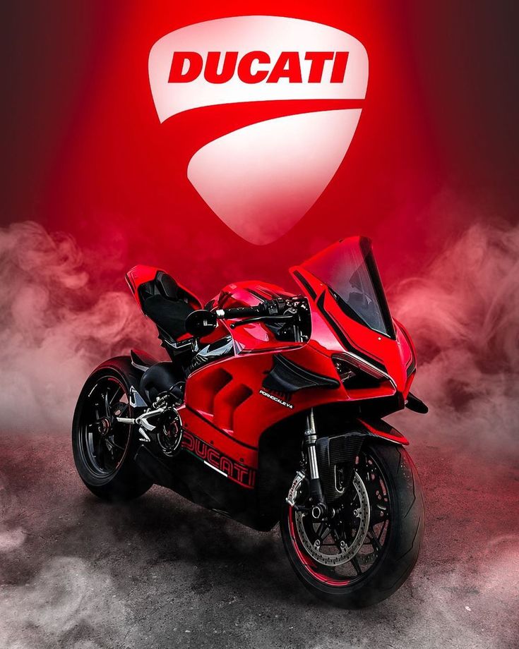 a red ducati motorcycle parked in front of a sign