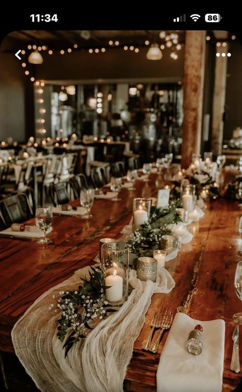 the table is set with candles and place settings