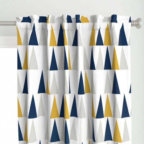 a curtain with blue, yellow and white triangles on it