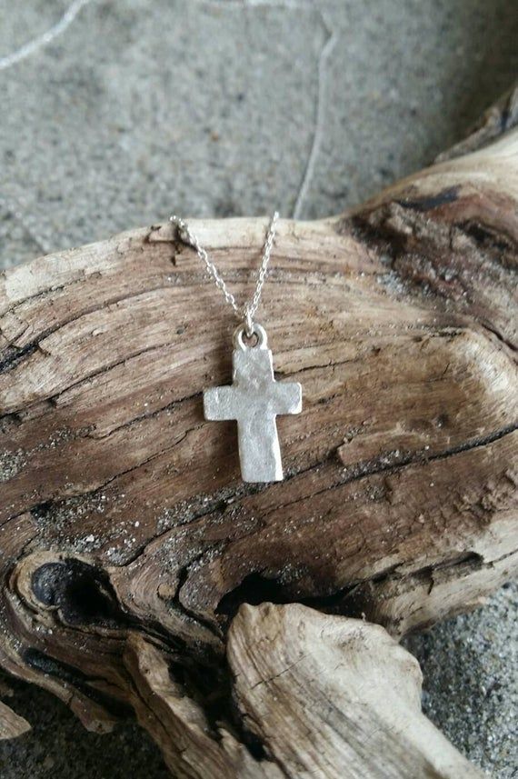 Rustic silver cross pendant necklace.The matte silver plated charm is 16 mm with a rustic hammered effect and an antiqued matte finish. It is a perfect layering necklace! Shown here in 16" length.This necklace also comes in matte 16K gold plated with 14K gold fill chain as shown in the last photo:https://www.etsy.com/listing/270859437/cross-necklace-rustic-cross-gold-cross?ref=shop_home_active_3*If you are unsure of the length you need, or would like to wear this item at different lengths, we no Tiny Gold Necklace, Small Gold Necklace, Cross Necklace Simple, Tiny Cross Necklace, Cross Charm Necklace, Rustic Cross, Tiny Necklace, Sterling Silver Cross Pendant, Silver Cross Pendant