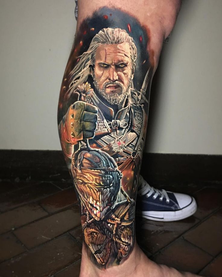 a man's leg with a tattoo on it and a character from the television game of thrones