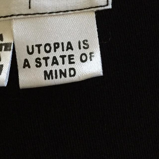 two tags that say utopia is a state of mind