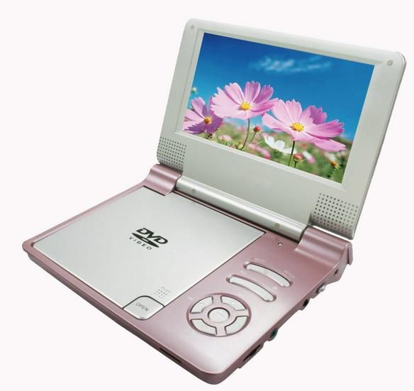 an open laptop computer sitting on top of a white surface with flowers in the screen