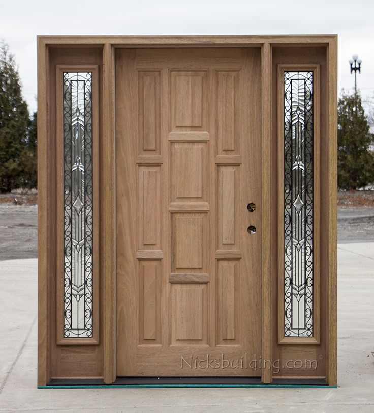 a wooden door with glass panels on the front and side doors in different sizes, shapes and colors