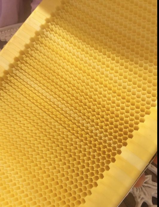 a close up view of some yellow honeycombs