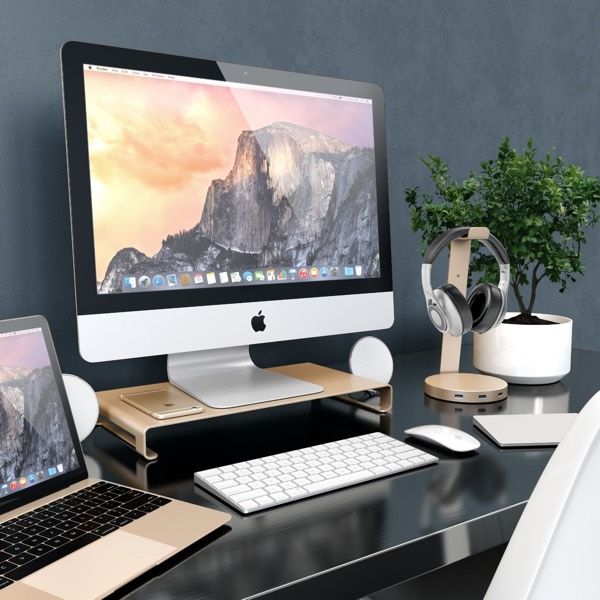 an apple desktop computer sitting on top of a desk next to a laptop and mouse