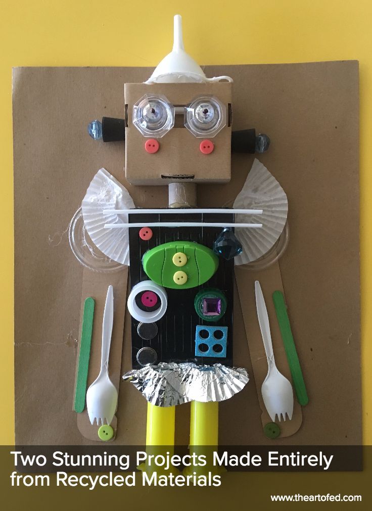 a paper doll made to look like a robot with utensils and spoons