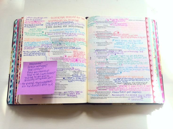 an open book with writing on it and a sticky note attached to the page,