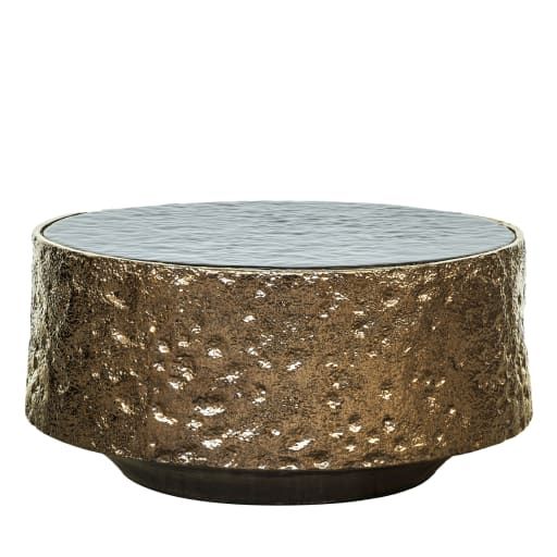 a round metal table with gold and silver foil on the top, against a white background