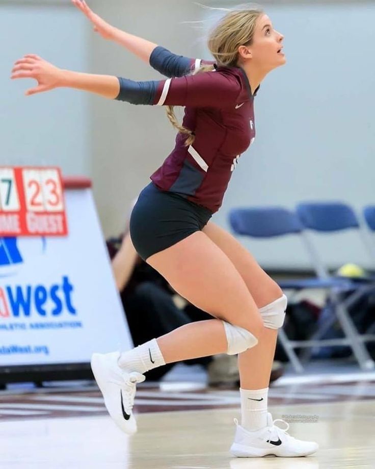 a female volleyball player in action on the court