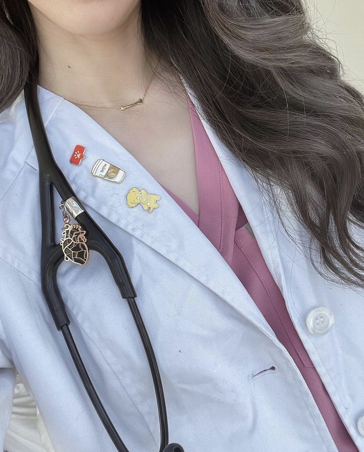 a close up of a person wearing a doctor's coat