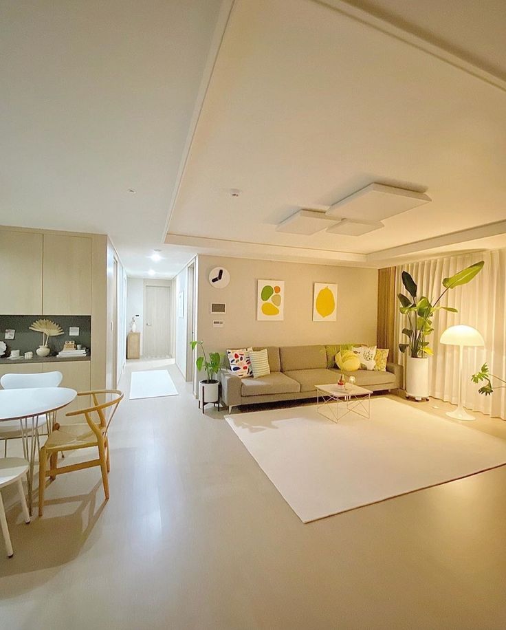 a living room filled with furniture and white walls