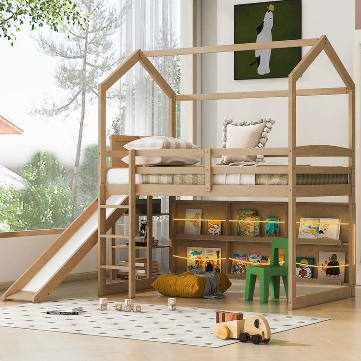 a child's bedroom with a bunk bed and slide