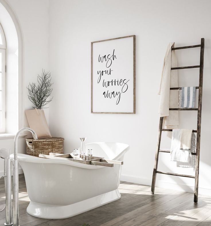 a bathroom with a white bathtub and ladder