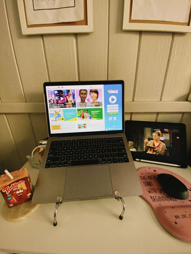 an open laptop computer sitting on top of a desk