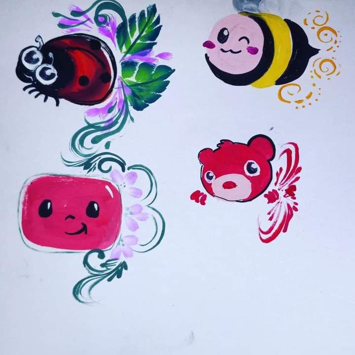 some stickers on the side of a refrigerator door that are decorated with animals and flowers