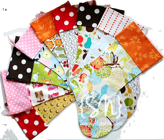 a bunch of different colors and patterns of cloths on a white background with polka dots