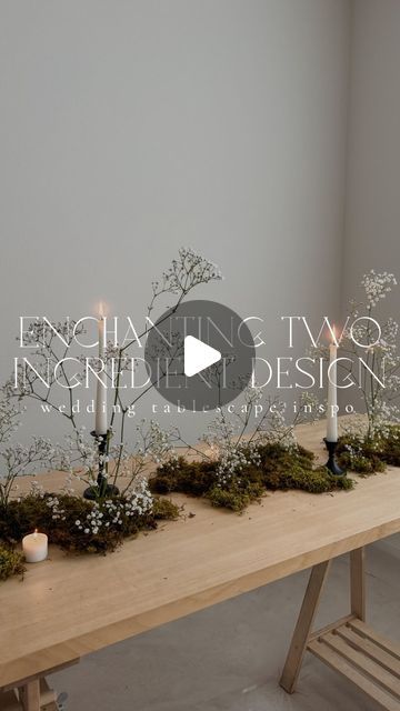 a wooden table topped with plants and candles