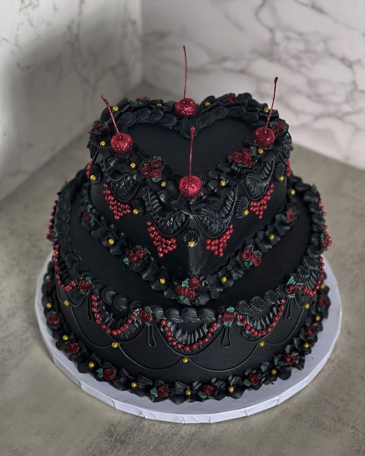 a heart shaped cake with red and black decorations