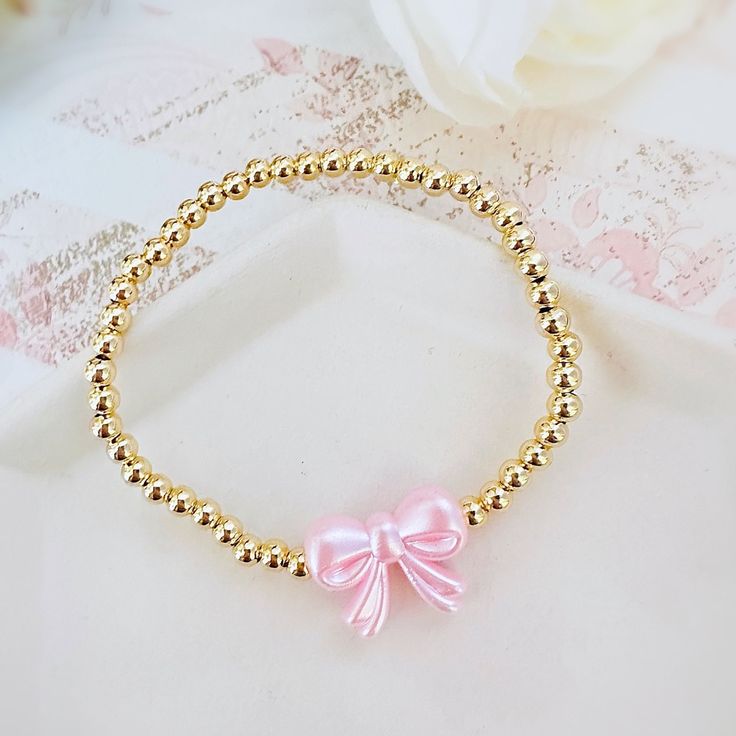 Gorgeous 14k Gold Plated 4mm Beaded Bracelet With A Pink Pearl Bow Bead Perfect Bracelet To Wear Alone Or Stacked With Other Favorite Pieces Bracelet Measures Approximately 7 Inches This Is For One Bracelet Only Tags: Preppy, Coquette, Pearls, Pink Bow, Spring Fashion, Gift For Her, Easter, Trend, Trendy, Love Shack Fancy, Stoney Clover Lane, Enewton, Mean Girls,, Bridgerton Preppy Gold Bracelet Stack, Couqutte Jewelry, Summer Jewelry Stack, Love Shack Fancy Jewelry, Preppy Brackets, Cute Party Favors For Teens, Preppy Stuff To Get For Your Birthday, Fancy Beaded Bracelets, Easter Beaded Bracelets