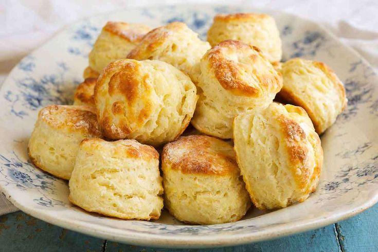 a plate filled with biscuits on top of a table