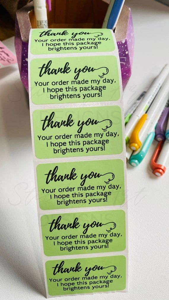 a set of four thank you notes with markers and pens on the table next to them