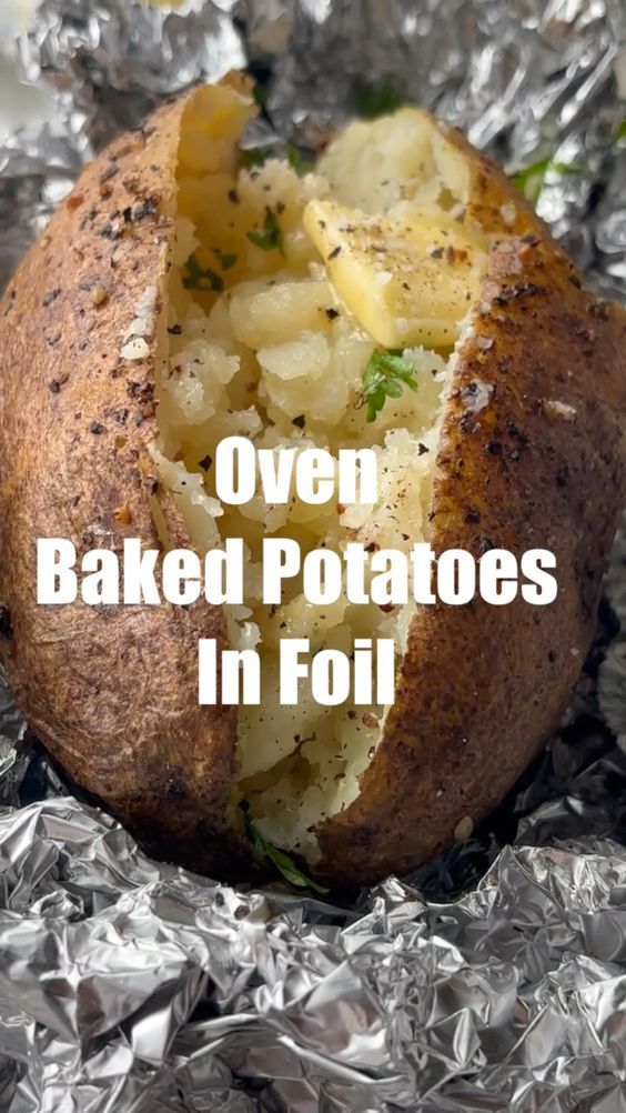 baked potatoes in foil with text overlay that reads oven baked potatoes in foil on top