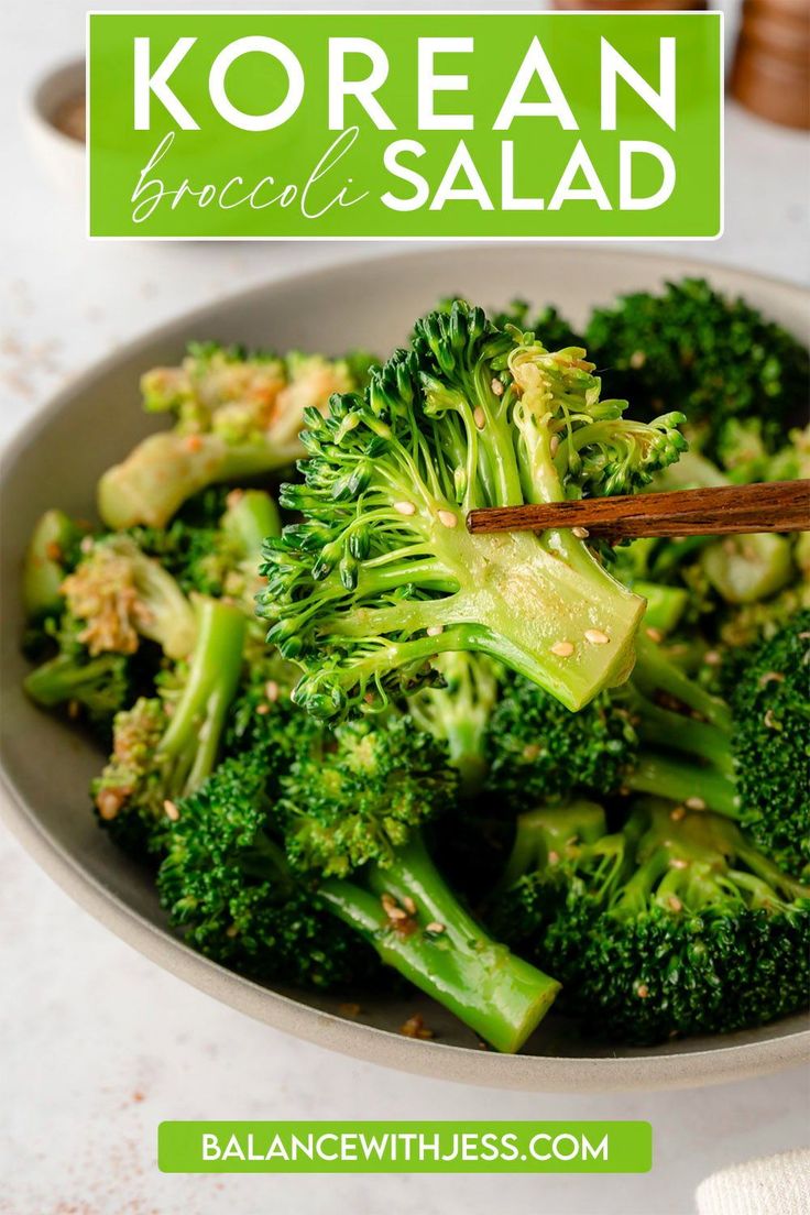 broccoli in a bowl with chopsticks sticking out of it and the title korean broccoli salad