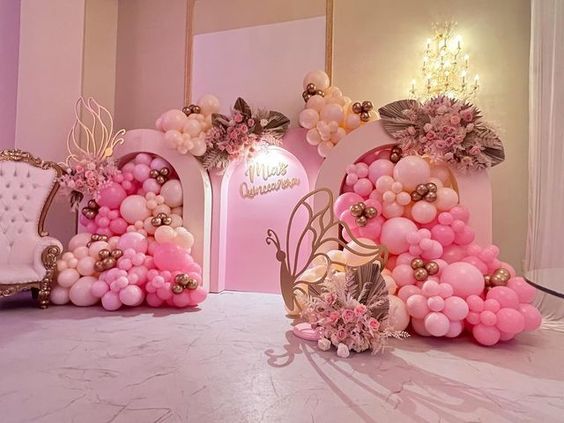 balloons and flowers are arranged on the floor